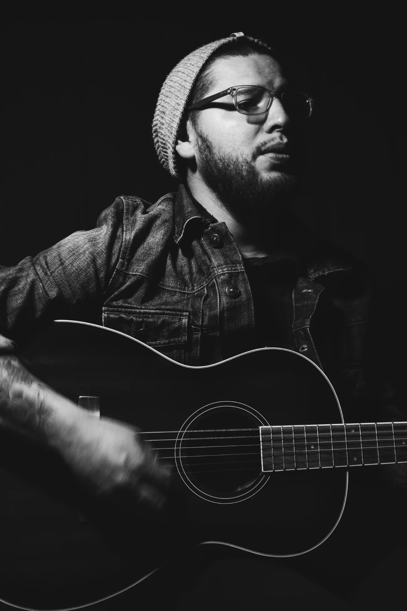 Singer-songwriter performing with acoustic guitar